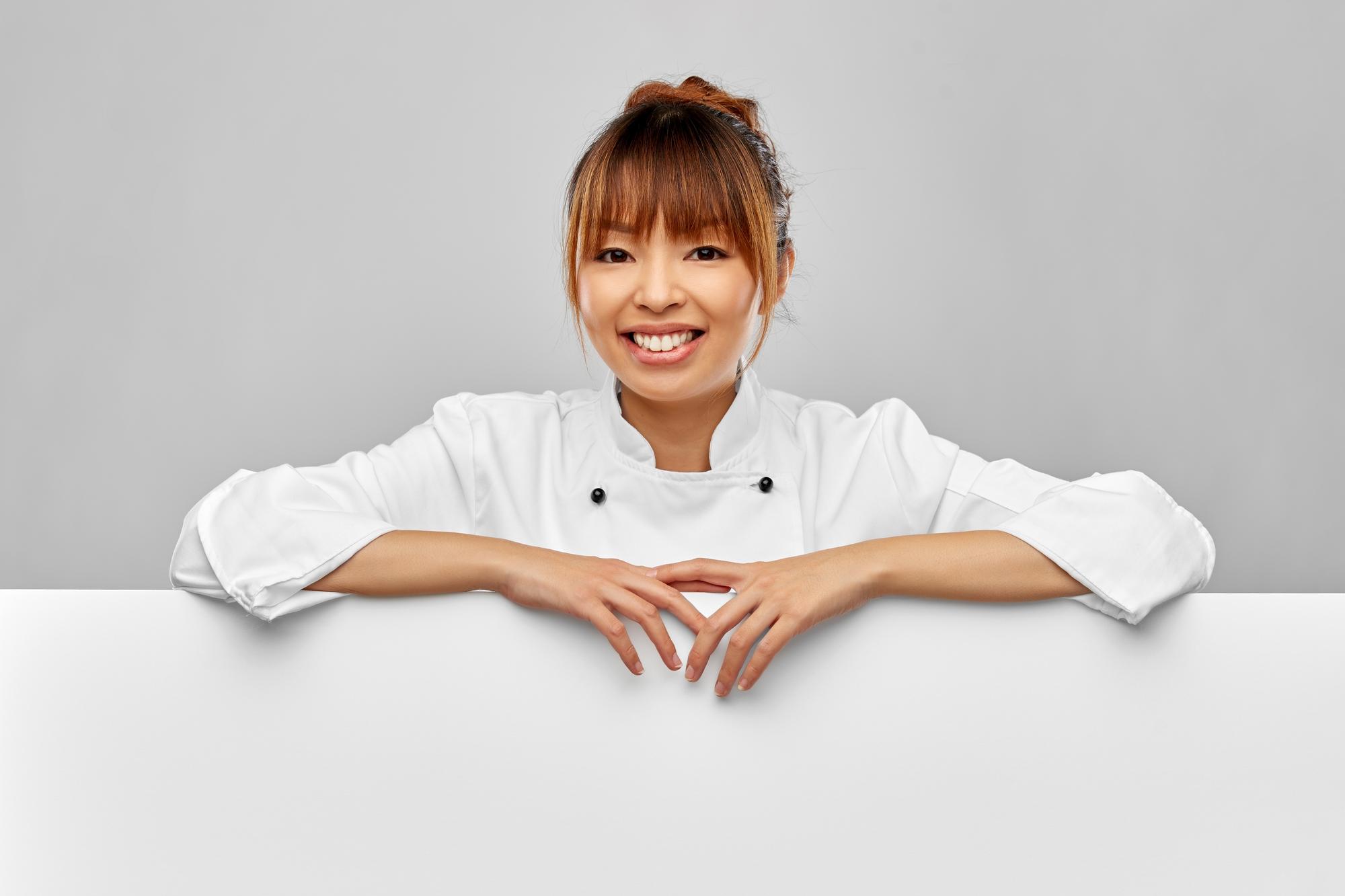 Chef welcoming guests into studio kitchen
